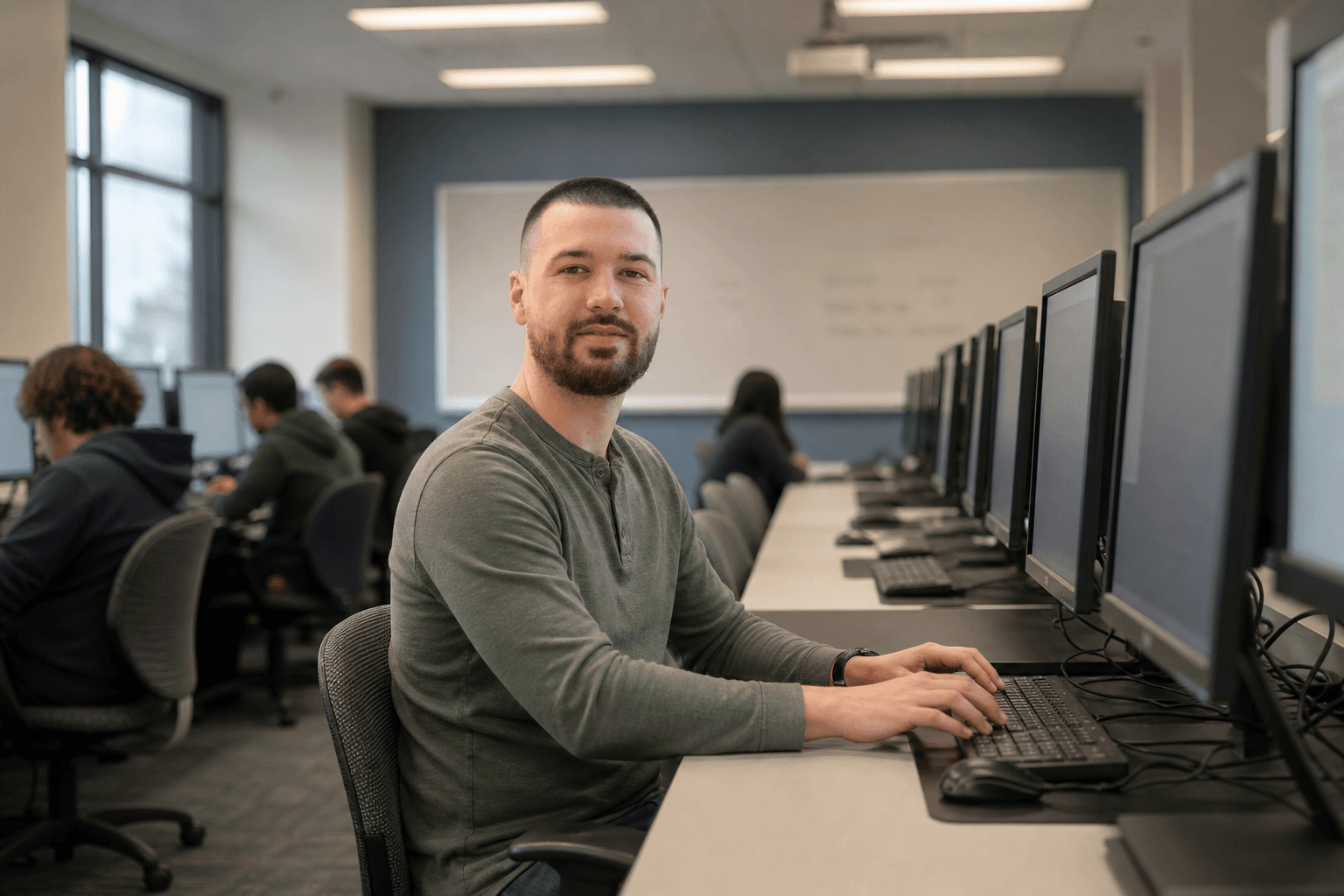Chandler Talley — in a tech classroom at a computer